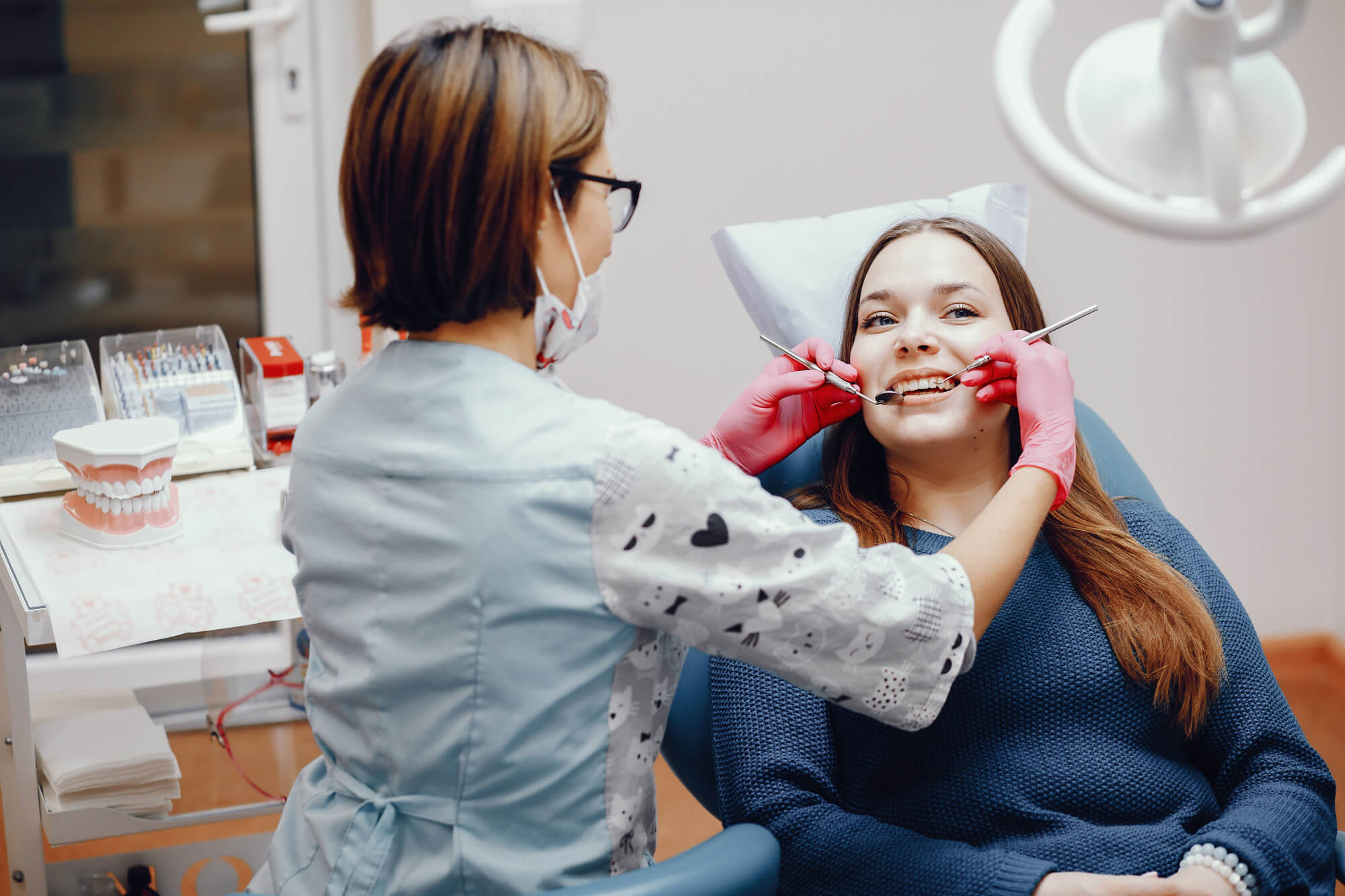 Dentist providing gentle dental care to a patient during a family dentistry visit in Buford GA at Great Smiles Buford Center